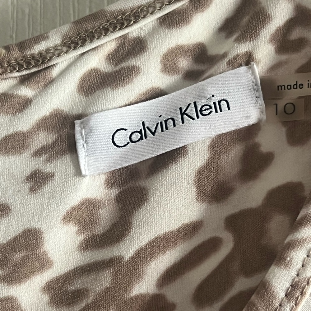 Cream animal print jumpsuit, worn once.  Excellent condition.